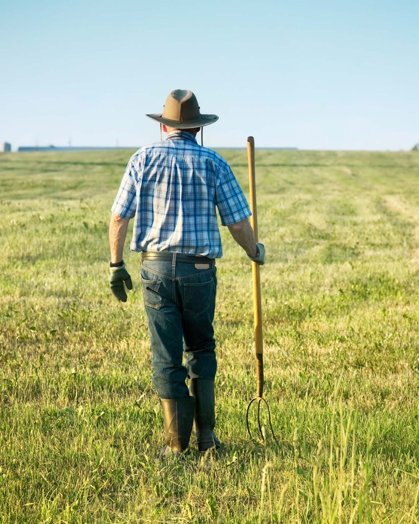 a armer walking down on his land