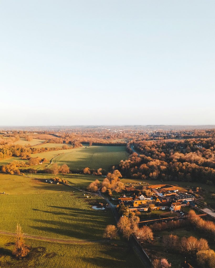 aerial view of a small village next to an free land area