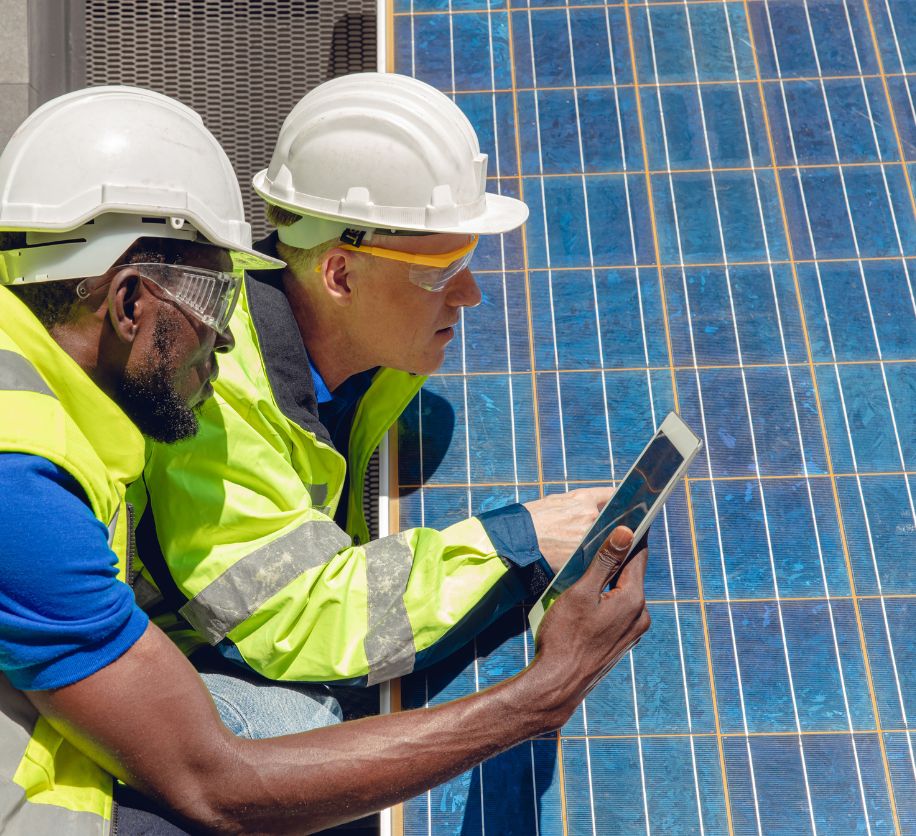 Technicians expecting a solar panel