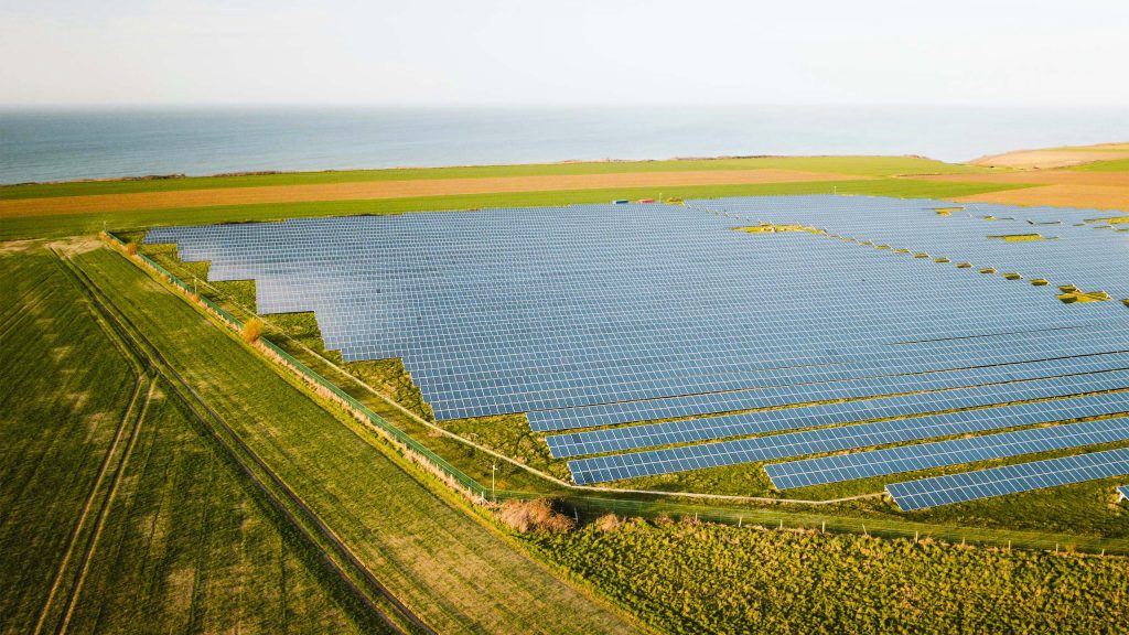 aerial view of a solar farm during sunset