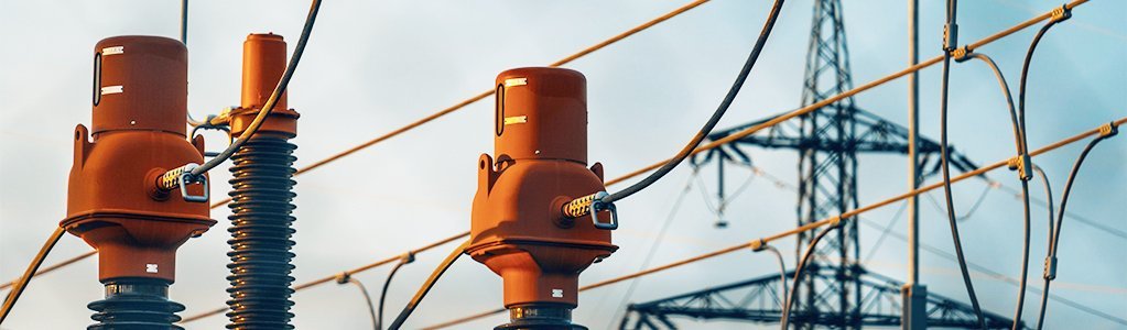 high voltage power lines at sunset