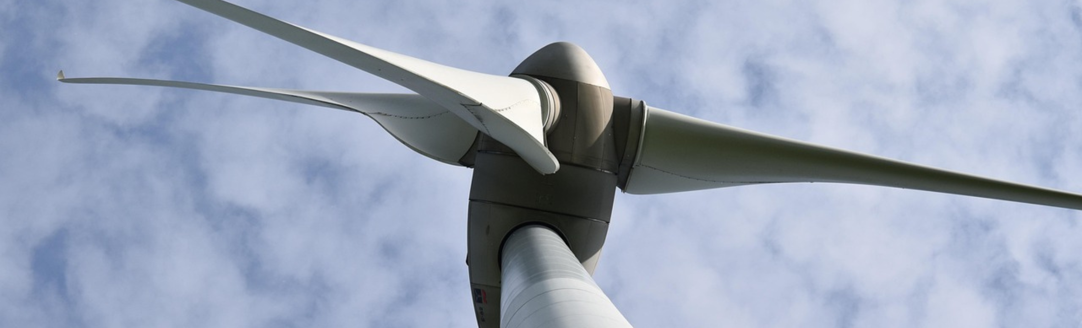 Wind turbine against a blue sky